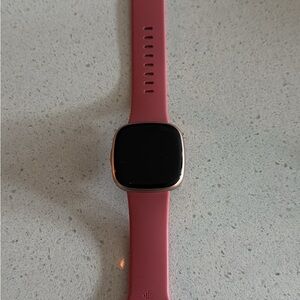 Fitbit Versa 4 with Pink Band